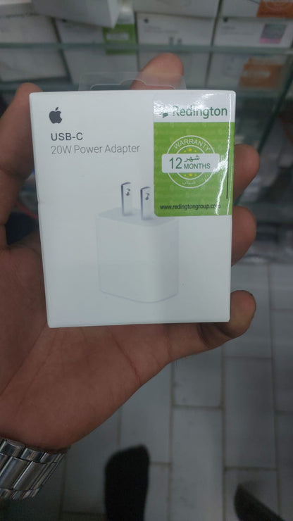 Person using the Apple 20W USB-C Adapter to charge an iPhone